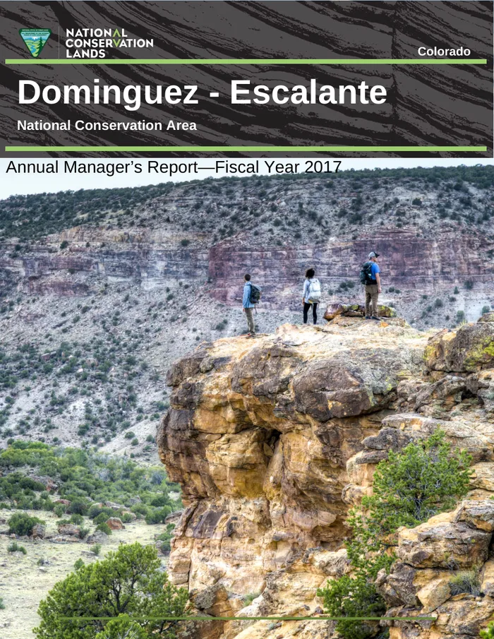 Cover of the Dominguez–Escalante NCA Annual Manager's Report 2017 — hikers on a canyon rim